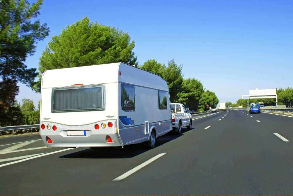 A campervan with electrical issues driving on the highway